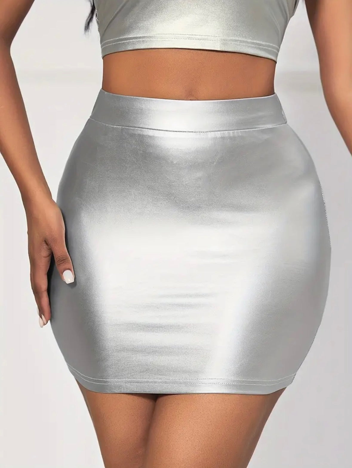 Shine Bright-Mini Skirt: Front view of shiny silver skirt on model.