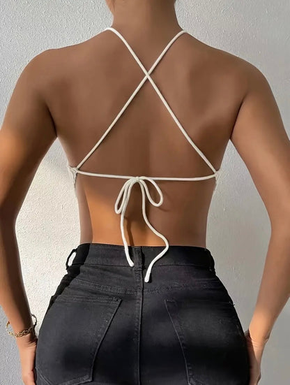 Knitted Crop Top: Back view of white crop top straps on model.