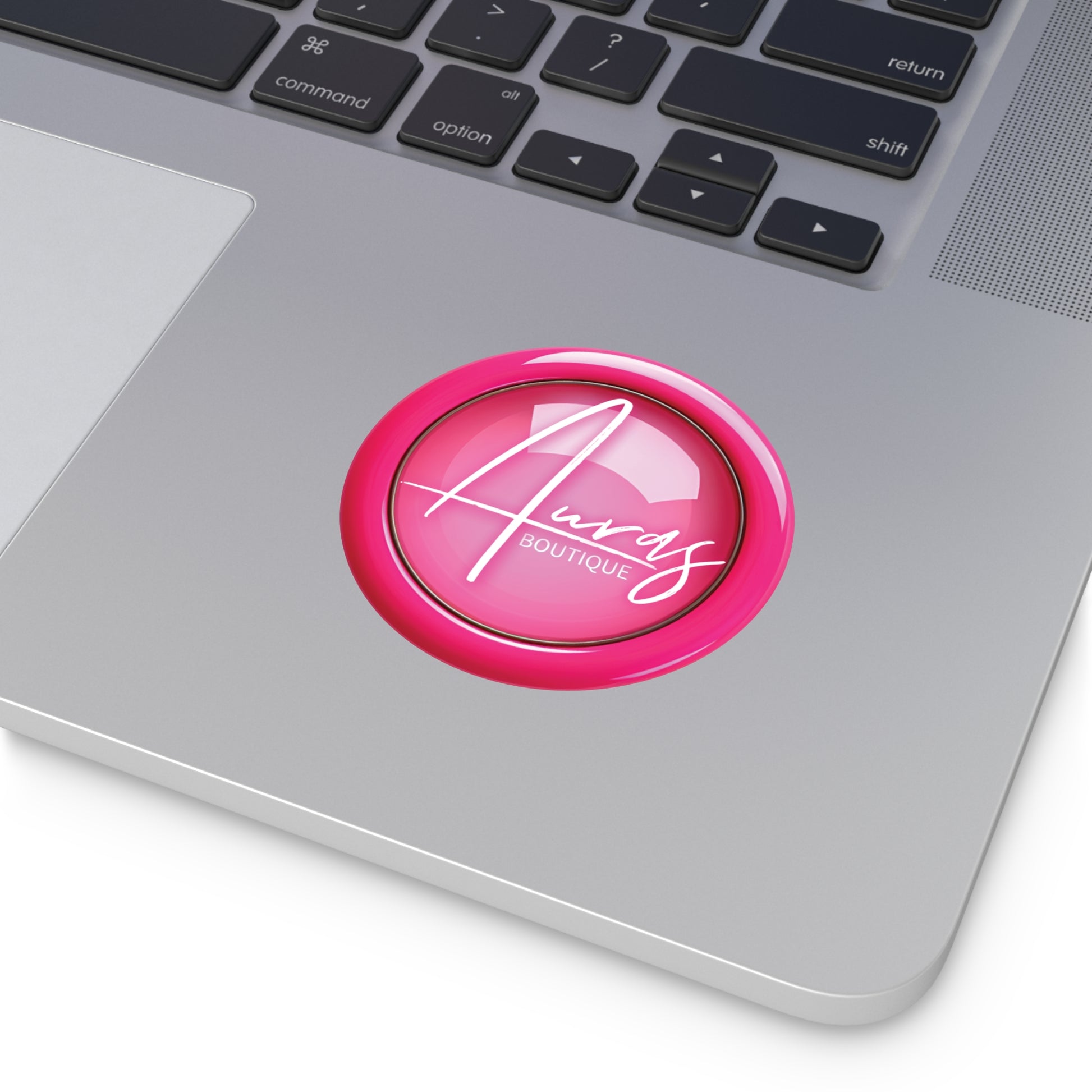 Auras branded sticker mockup image on a MacBook 