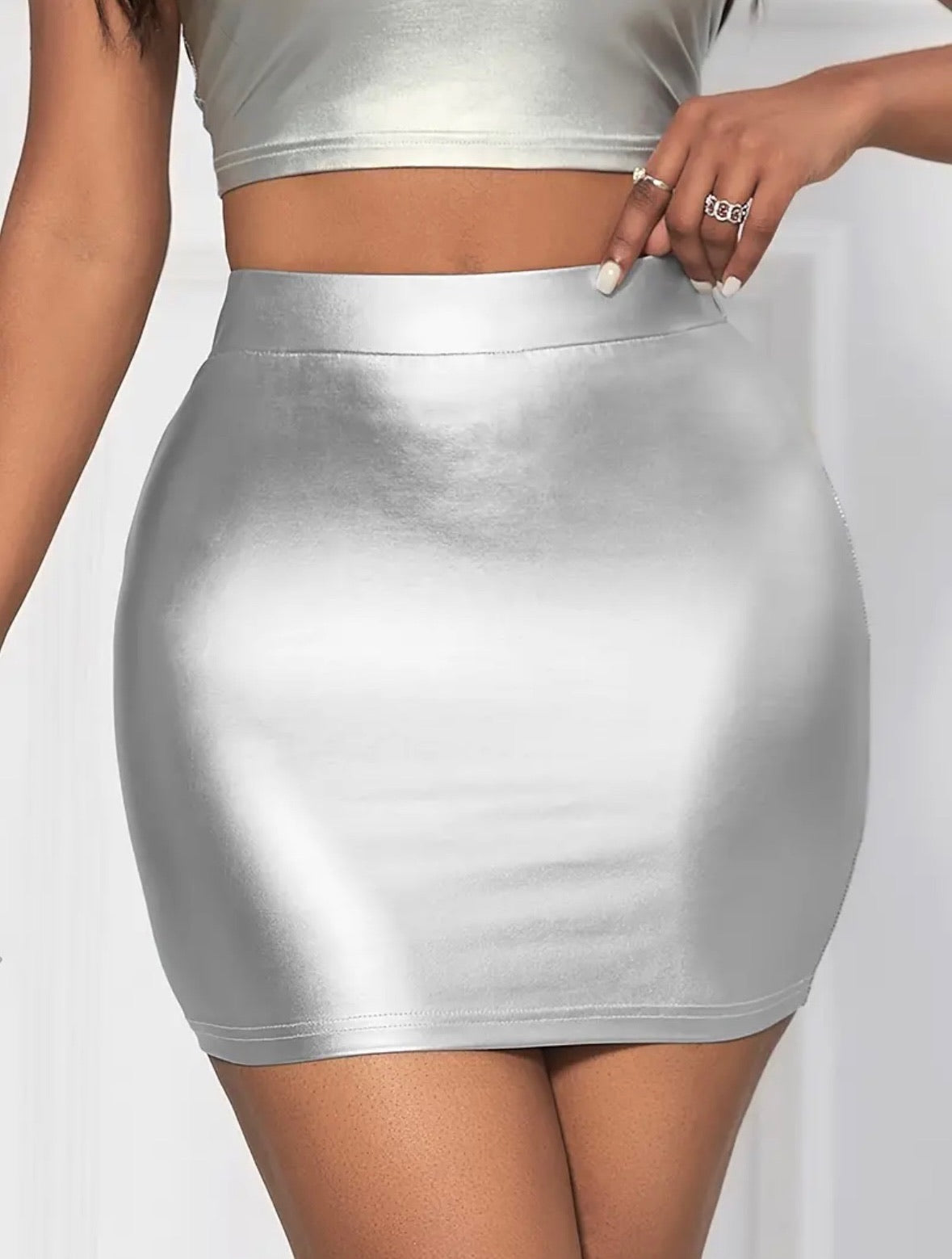 Shine Bright-Mini Skirt: Front view of shiny silver skirt on model.