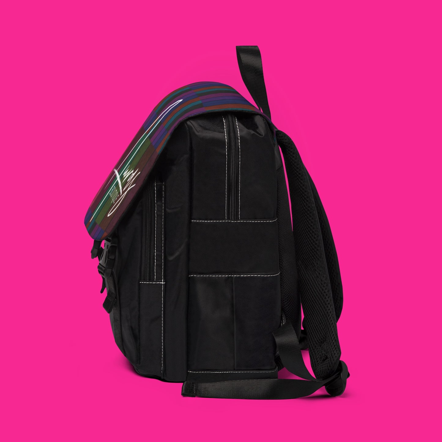 A touch of fun! Auras Boutique's Casual black backpack features a statement multicolored flap (including shades of (purple, blue, green, and burgundy) with buckles. Shop trendy & functional bags.