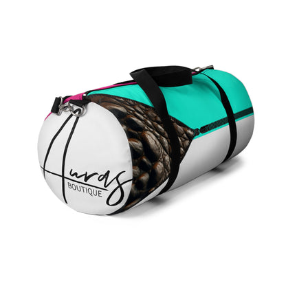 LUXE-Duffel: Right side view of white bag with crocodile texture print over Auras Rose and Auras Turquoise.