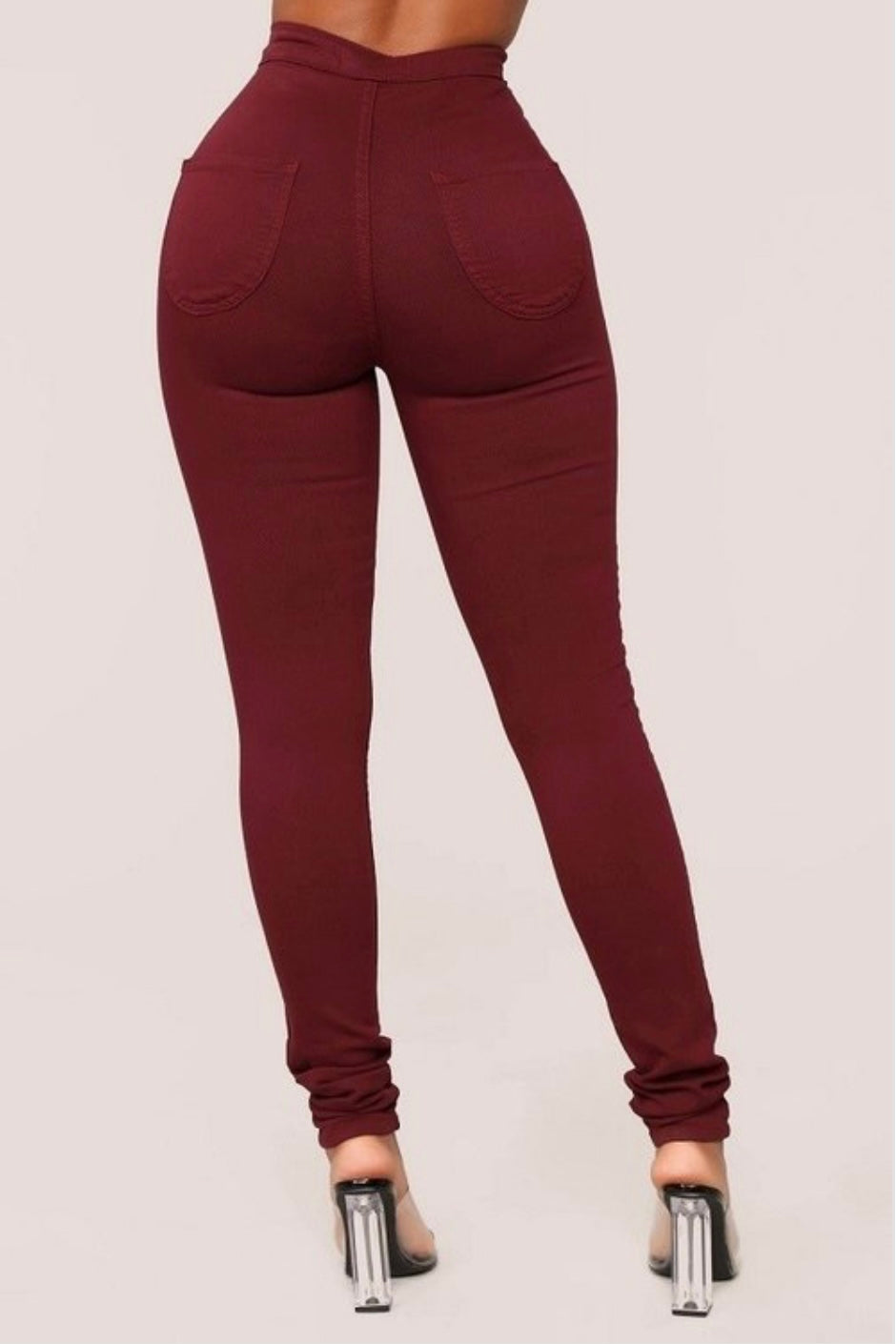 Burgundy Bliss: Back view of burgundy denim jeans on model.