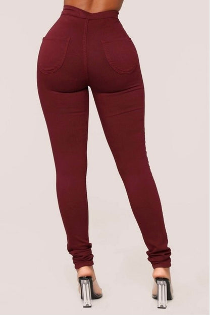 Burgundy Bliss: Back view of burgundy denim jeans on model.