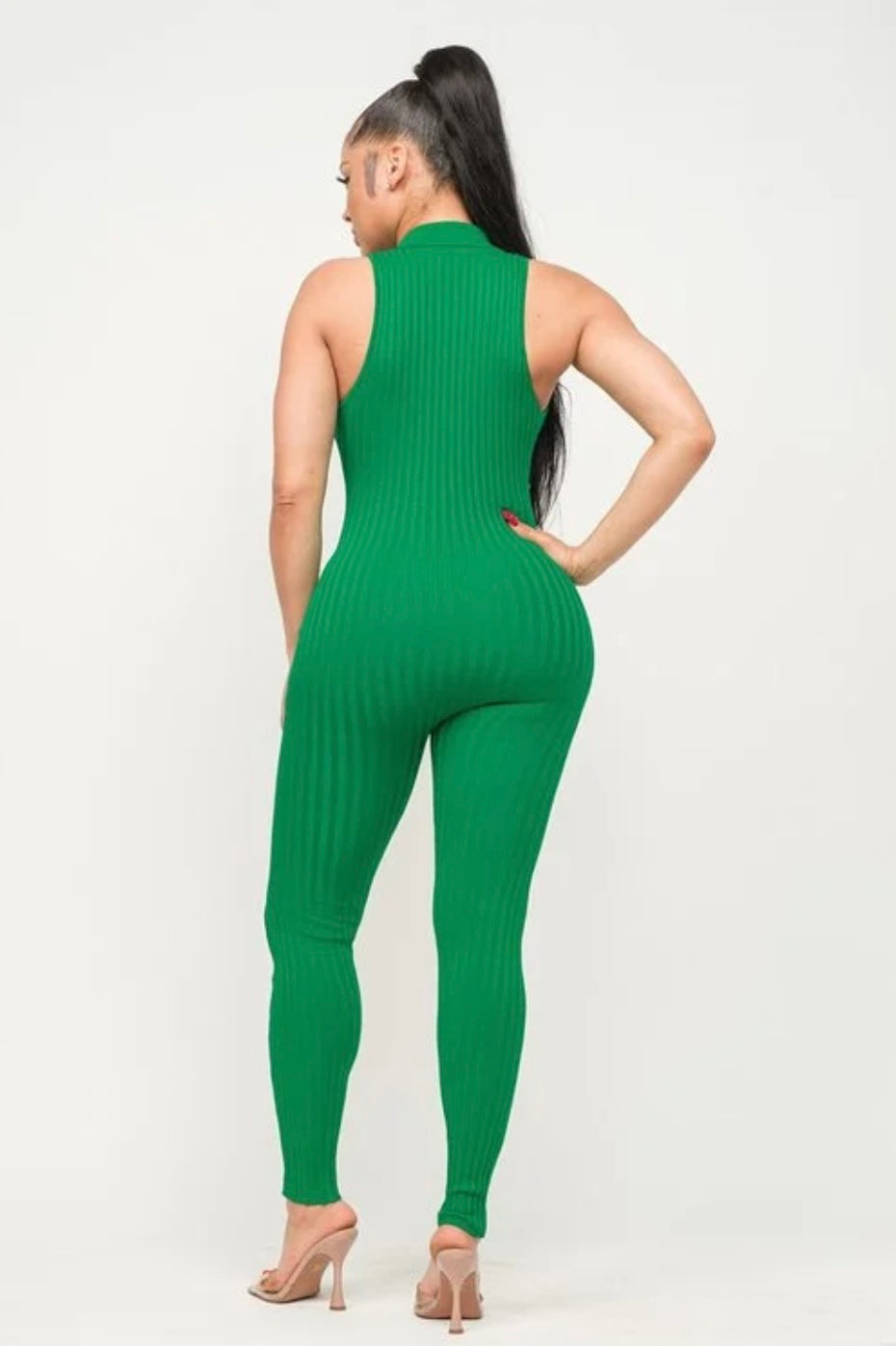 Jaded Bodysuit: Back view of sleeveless green bodysuit with collar & gold buttons from chest to ankle on model.