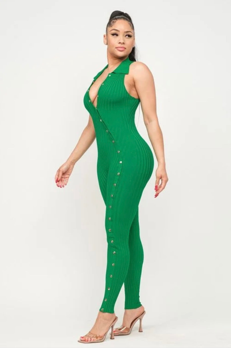 Jaded Bodysuit: Right side view of sleeveless green bodysuit with collar & gold buttons from chest to ankle on model.