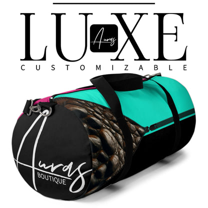 Luxe- Duffel: Mockup image of black, white and grey customizable bag with crocodile and gold texture print over Auras Rose, Auras Turquoise, coral, khaki, beige, merlot, white, and black.