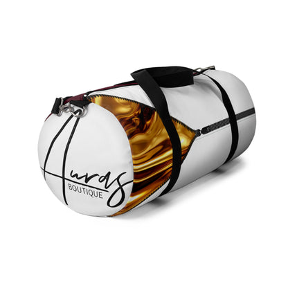 LUXE-Duffel: Left side view of white bag with gold texture print over merlot and white.