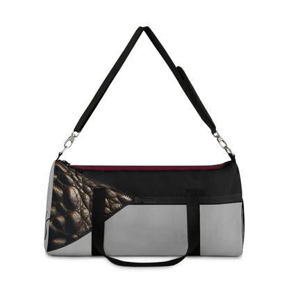 LUXE- Duffel: Front view of light grey bag with crocodile texture print over merlot and black.