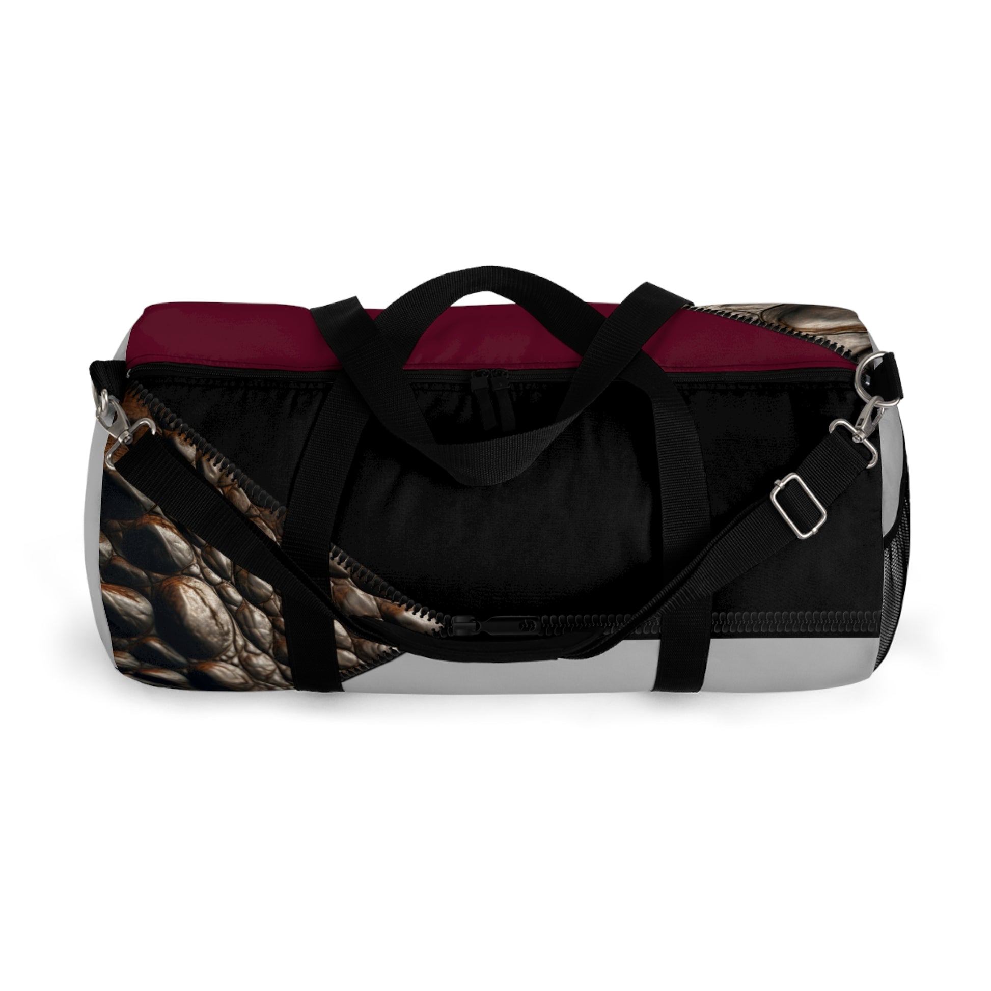 LUXE- Duffel: Top view of light grey bag with crocodile texture print over merlot and black.